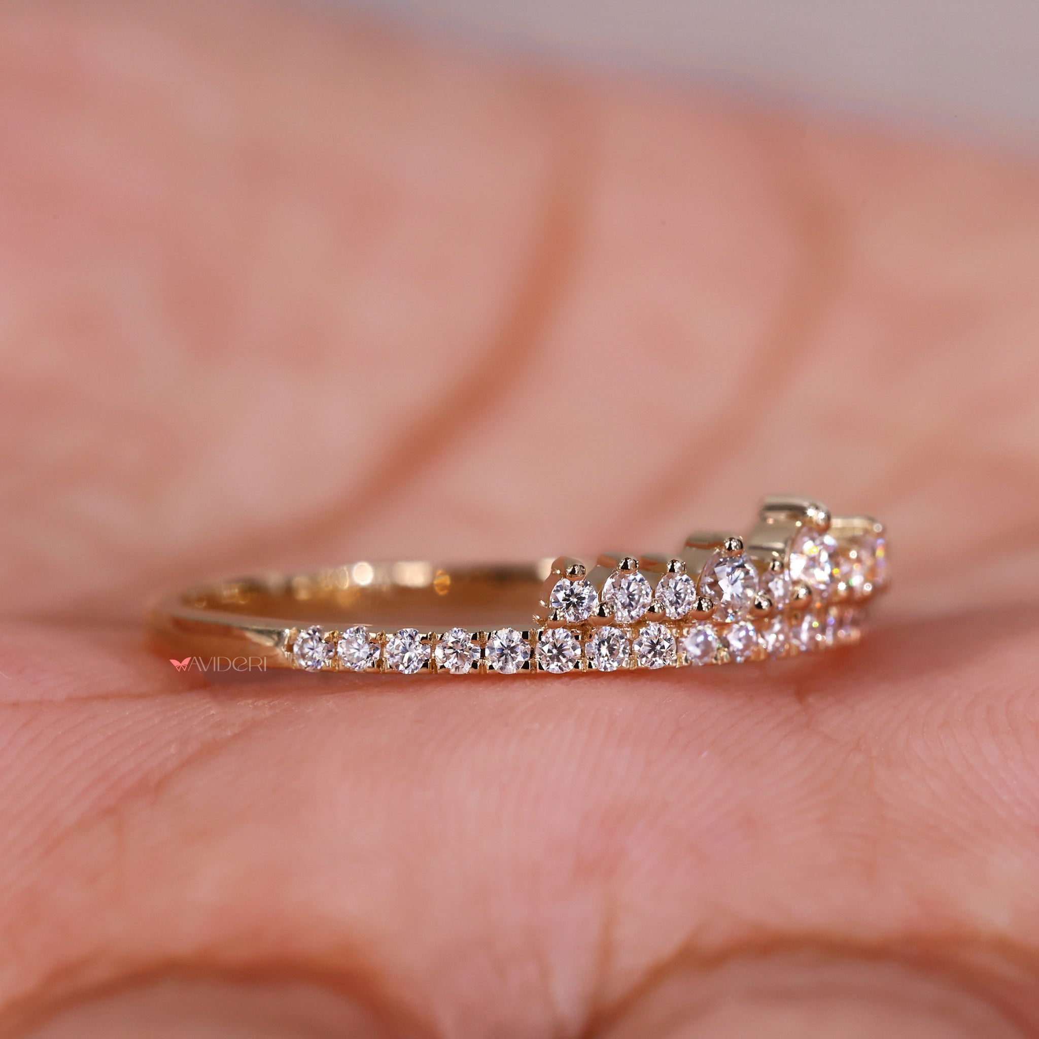 Round diamond pave band with intricate detailing.