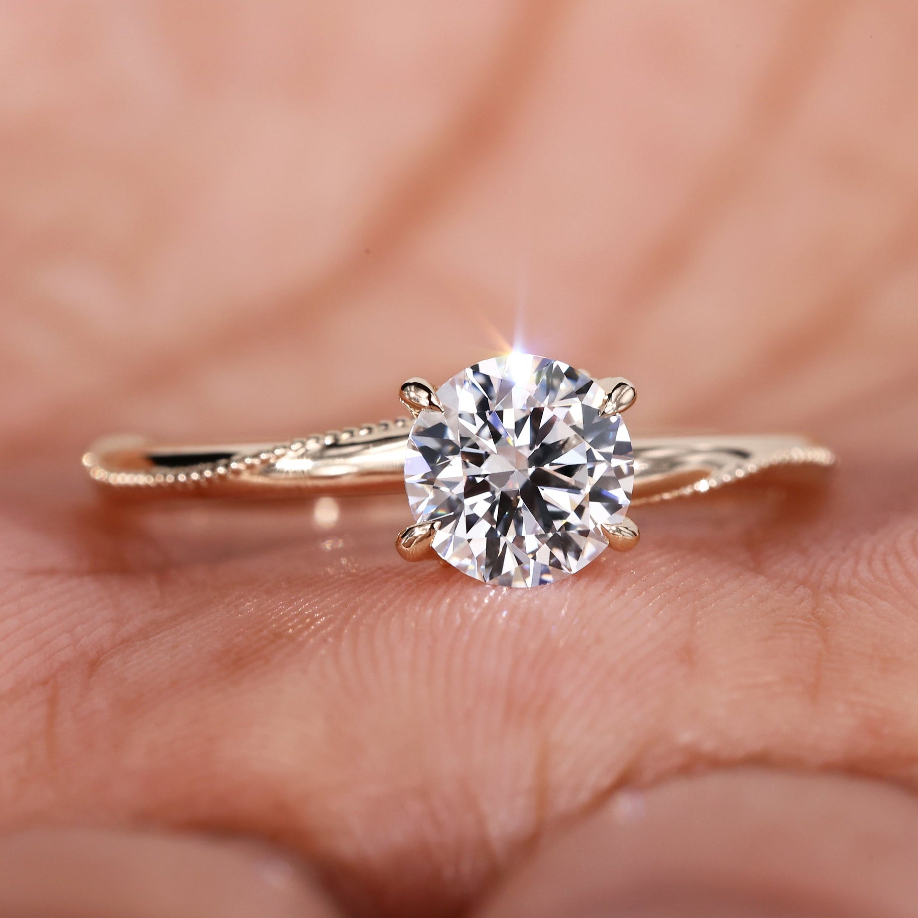 Milgrain engagement ring featuring a lab diamond engagement ring in an elegant solitaire design with a gold finish.