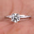 2 ct round diamond engagement ring featuring a stunning hidden halo design in a handcrafted setting. 2 ct round diamond engagement ring featuring a stunning hidden halo design in a handcrafted setting.