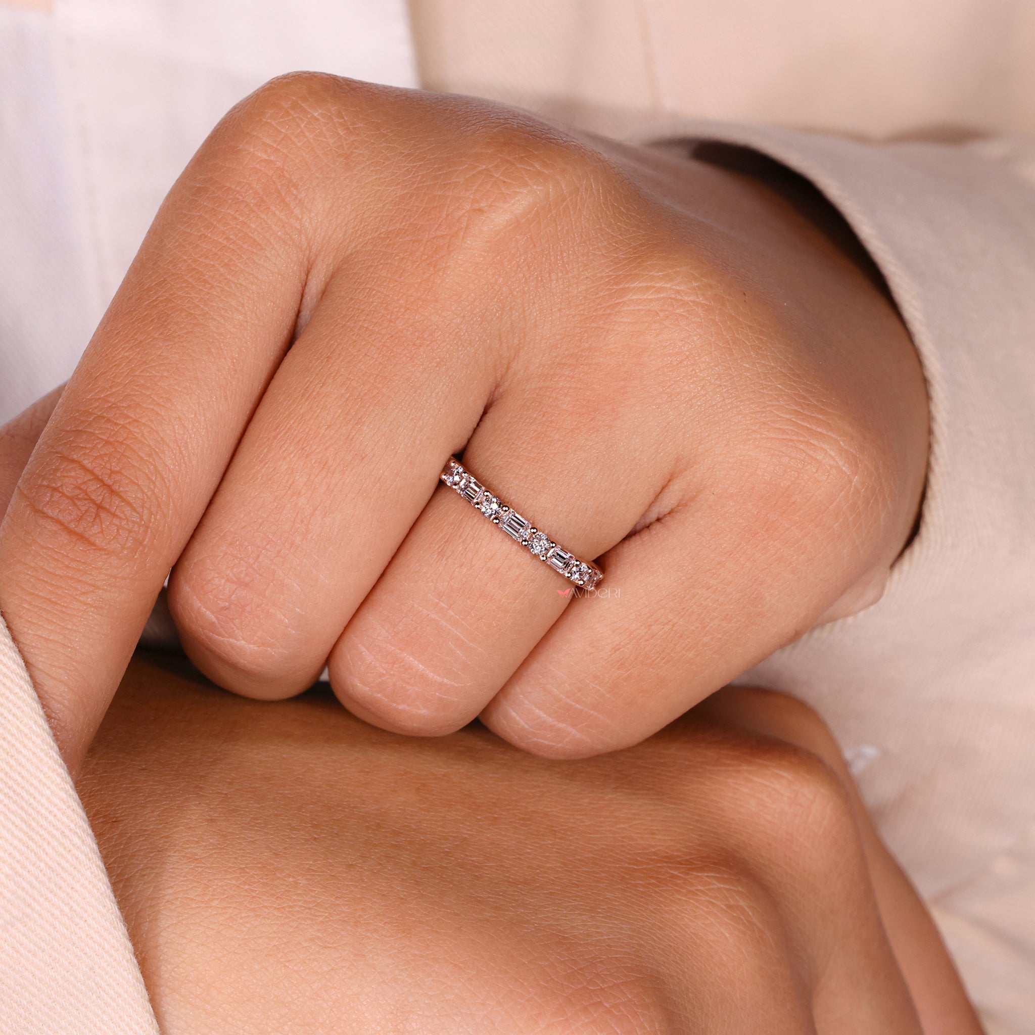 Prong setting band showcasing diamonds in a secure setting.