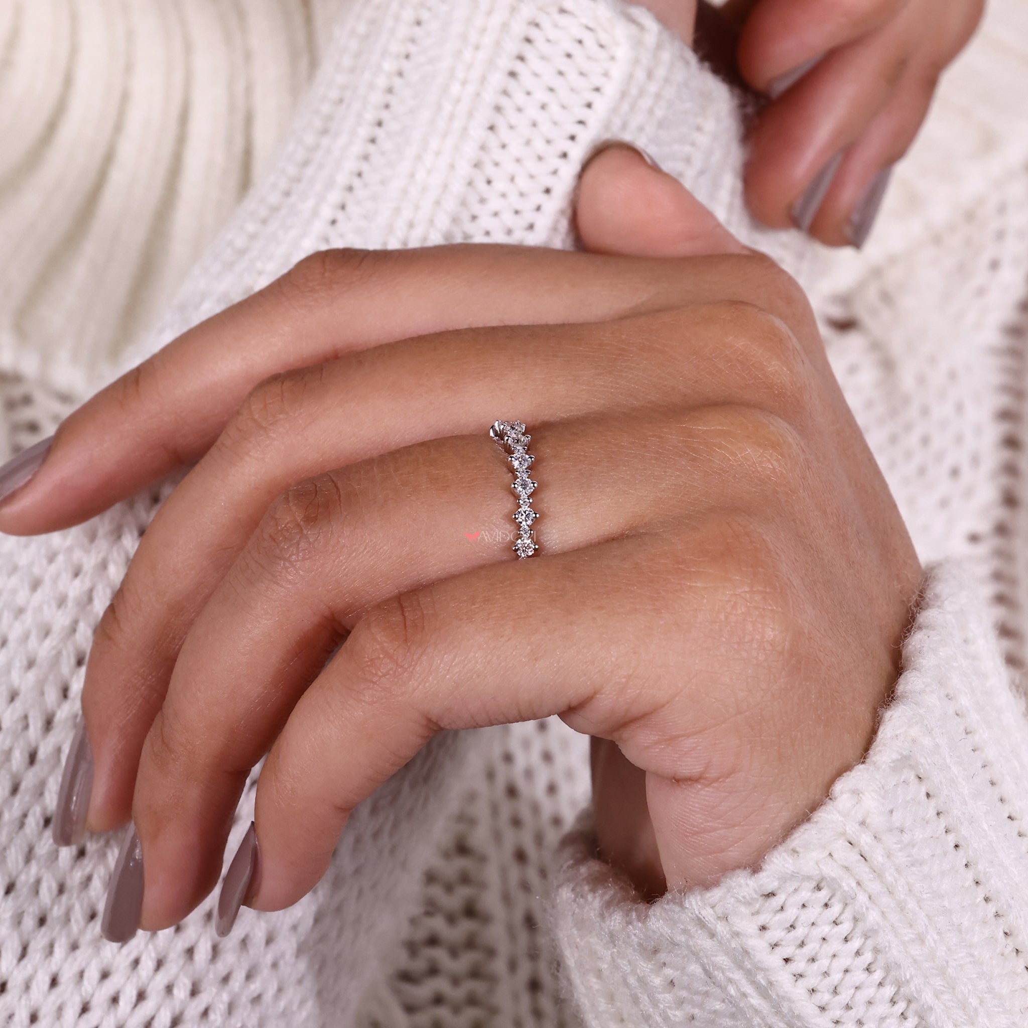 White gold wedding band featuring brilliant diamonds in a timeless design.