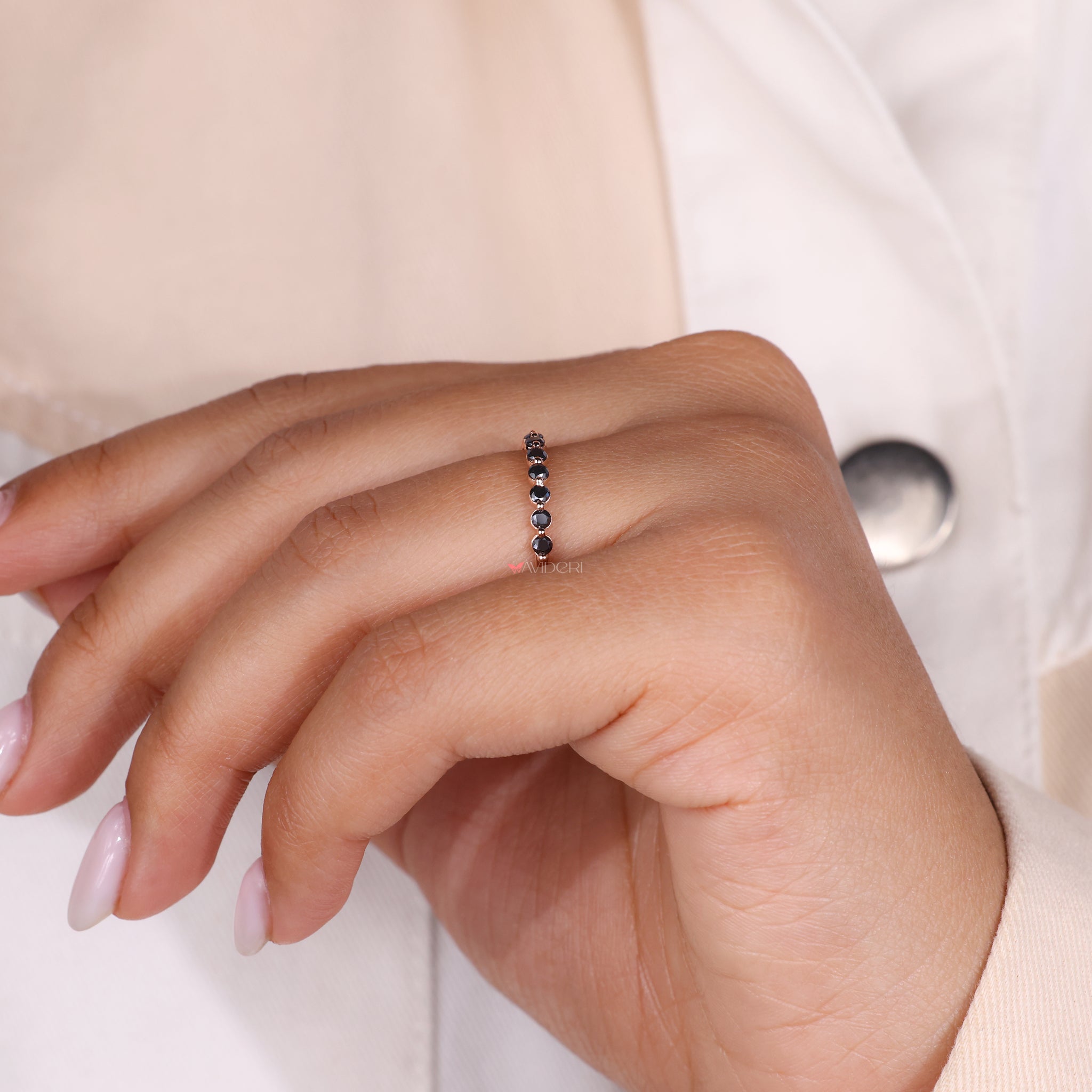 Shared prong wedding band featuring moissanite for a classic design.