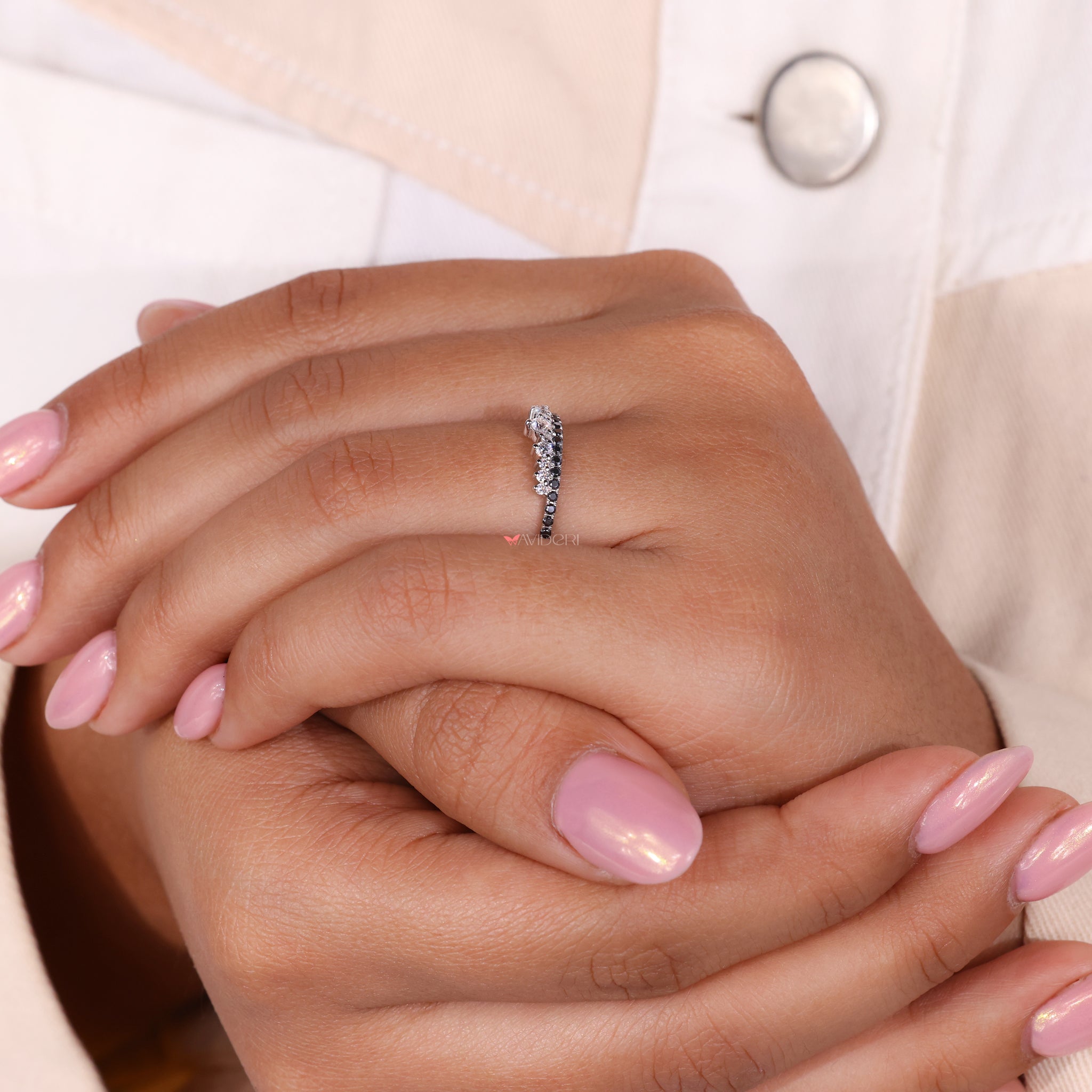 White gold wedding band with a round wedding band and moissanite design.