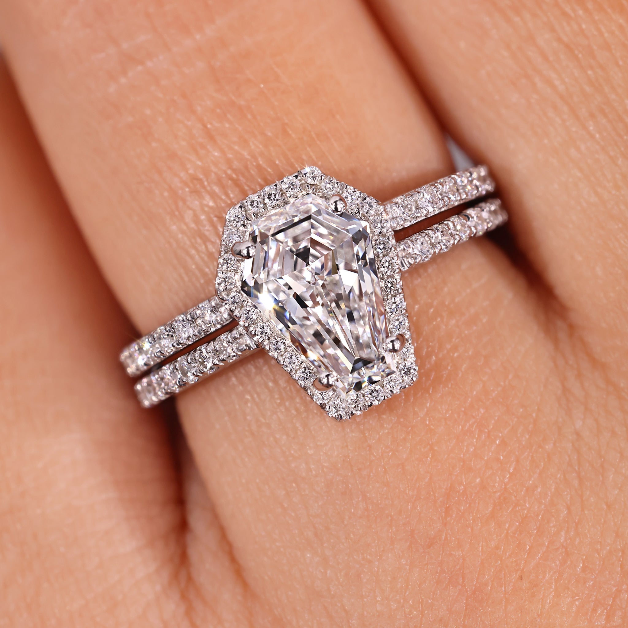 Coffin diamond ring paired with matching wedding band.
