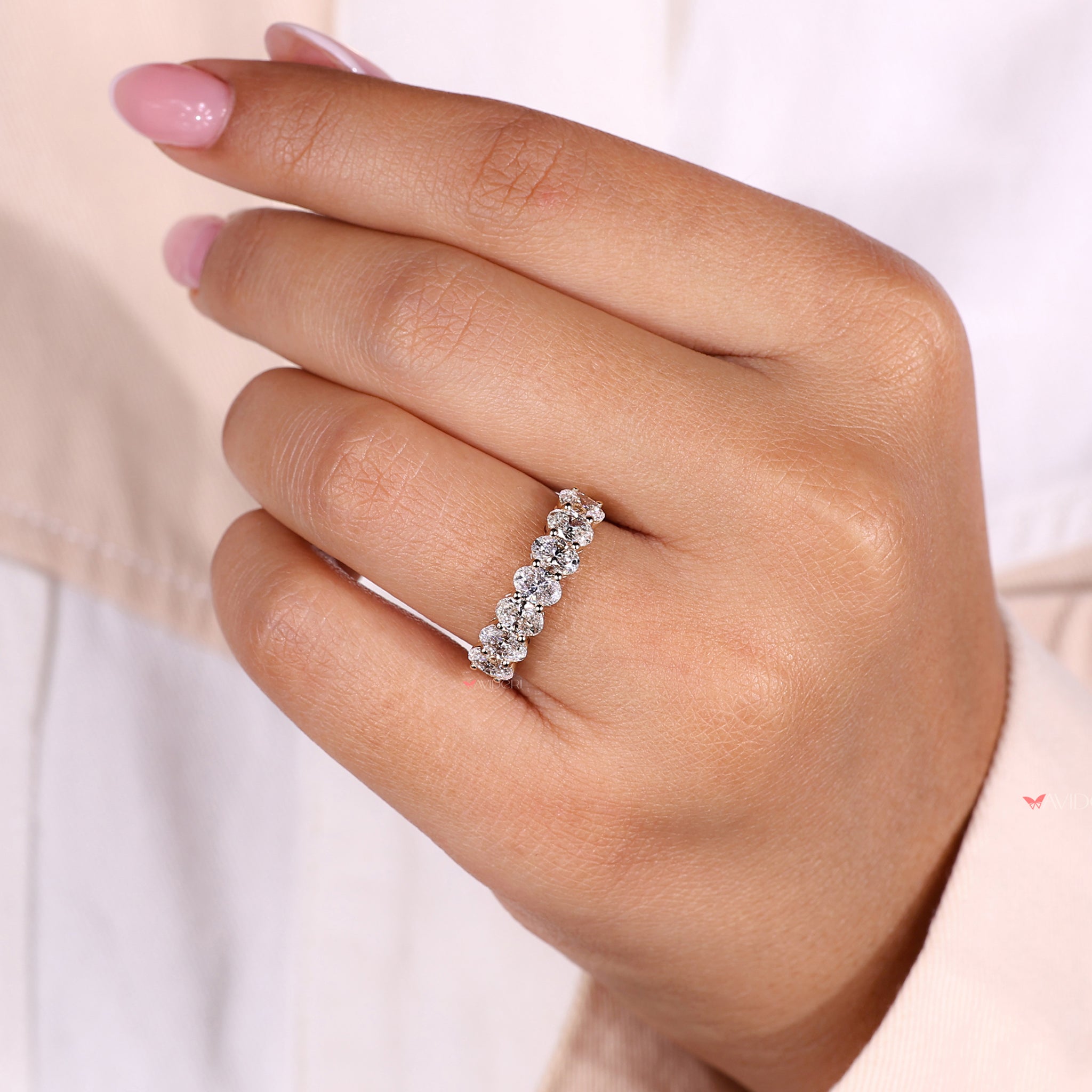Seven stone diamond band with a dazzling row of oval diamonds