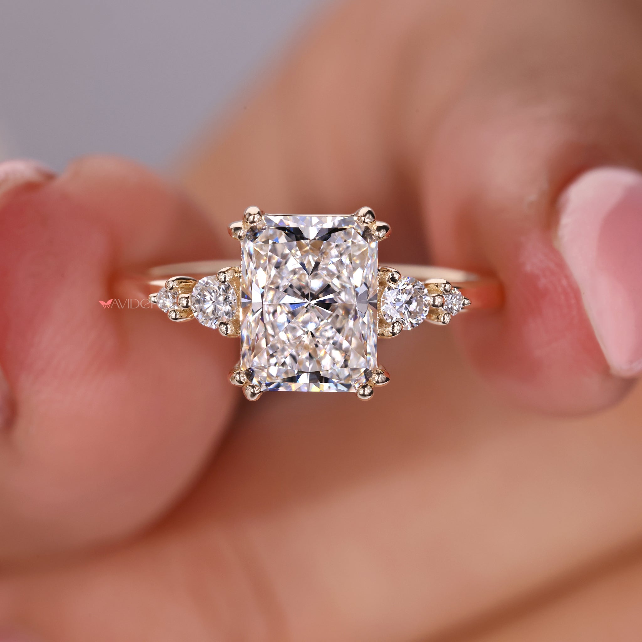 Prong setting radiant cut diamond ring for a classic and secure design.