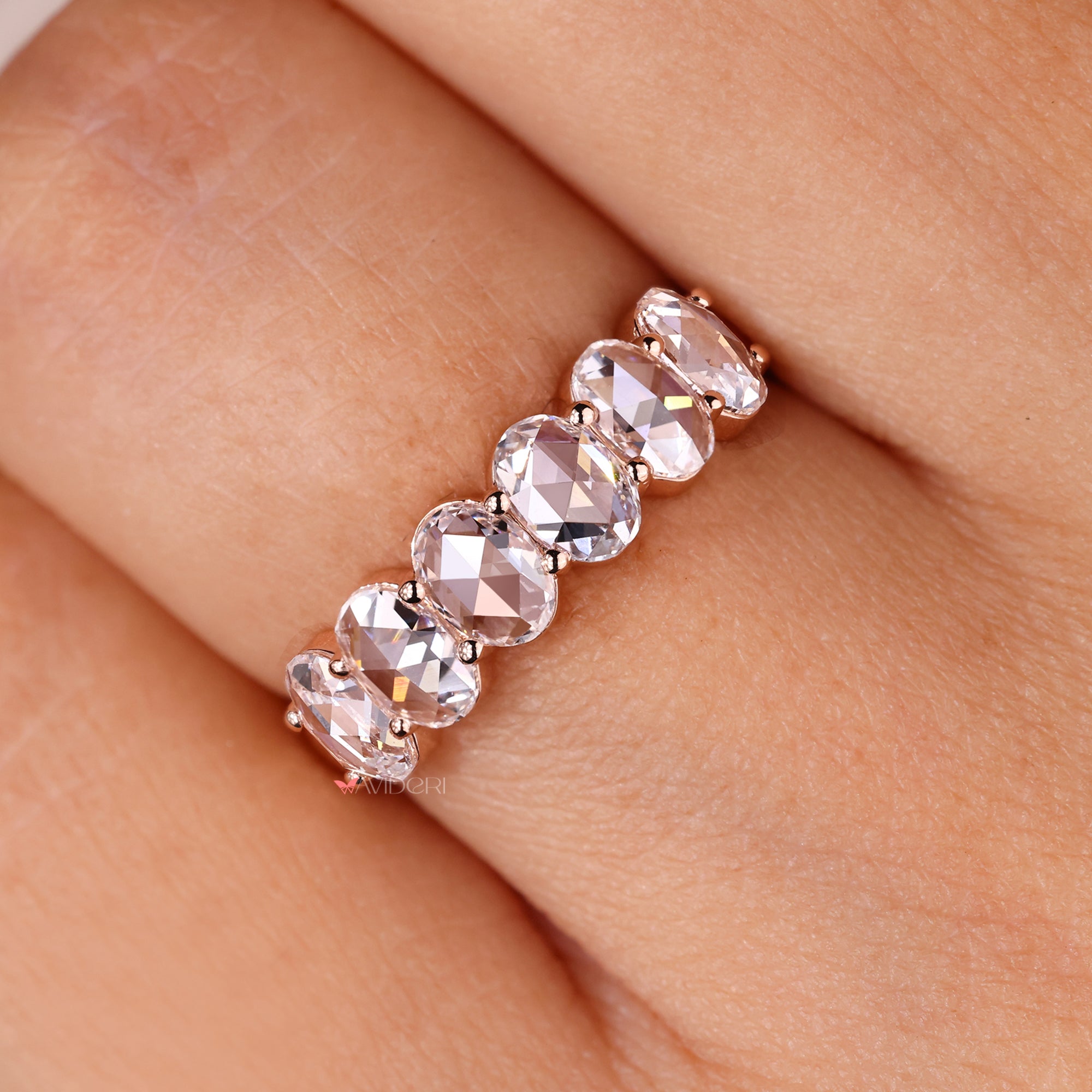 Unique custom band with oval rose cut diamonds.