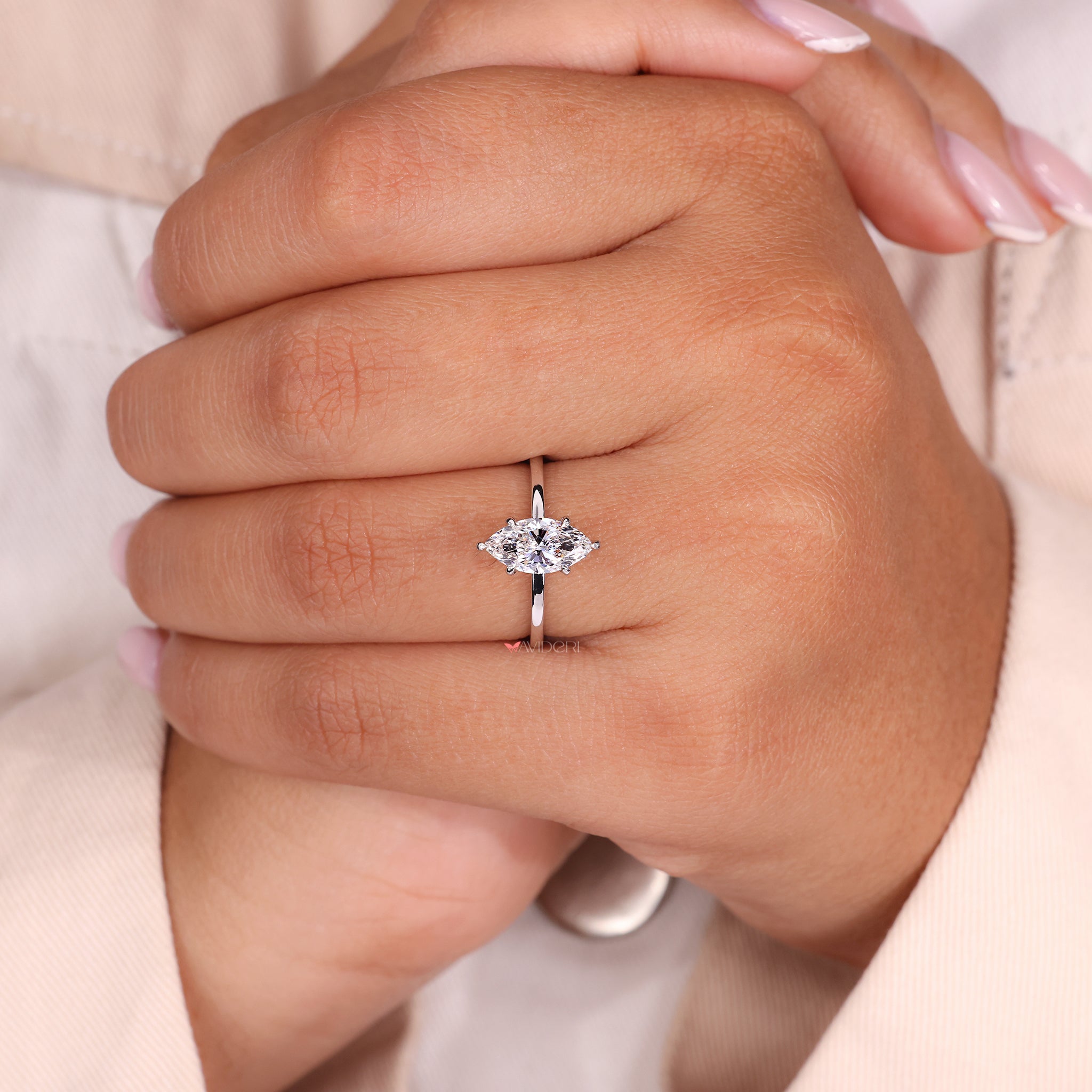 White gold ring with a claw prong setting.