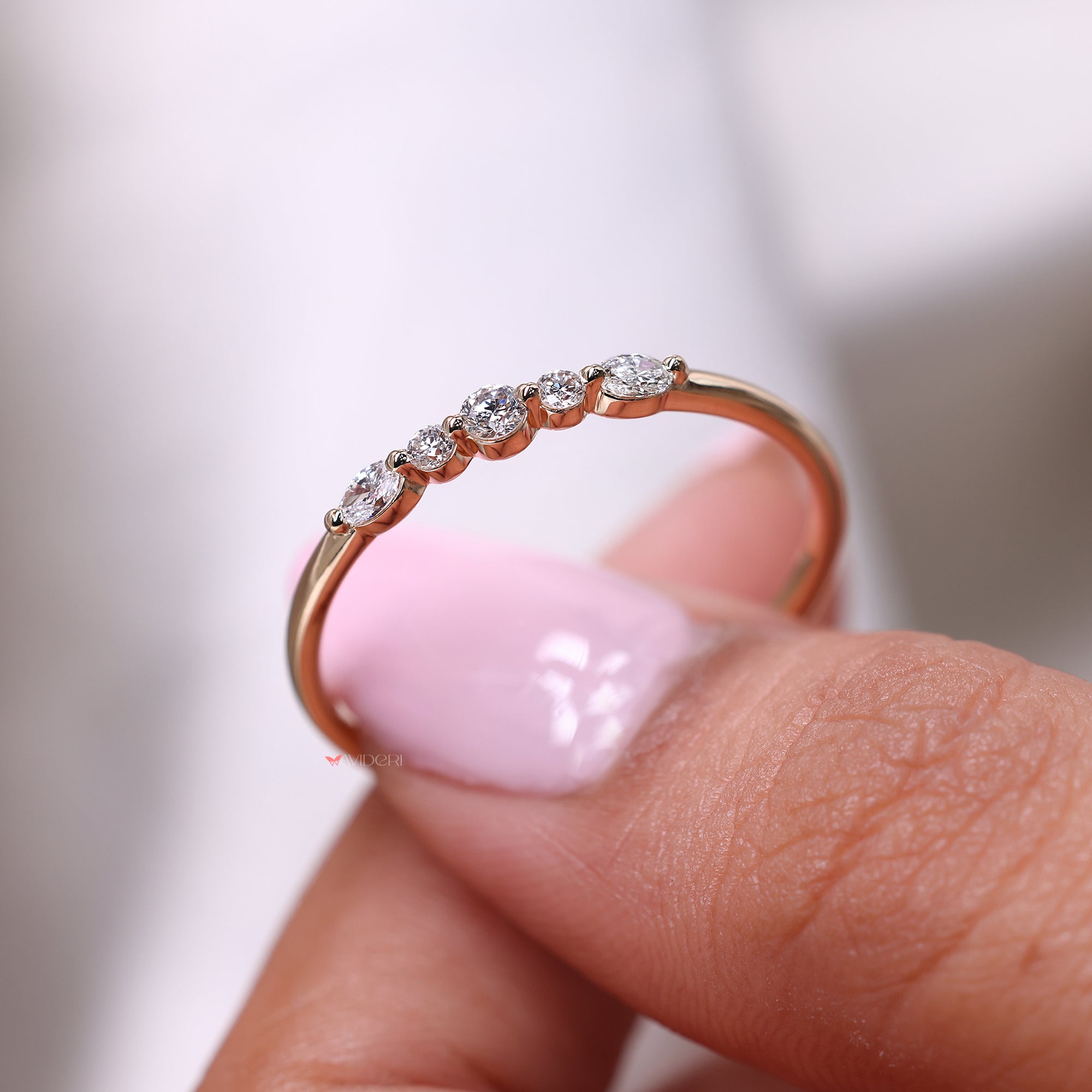 Diamond set east to west in yellow gold wedding band.