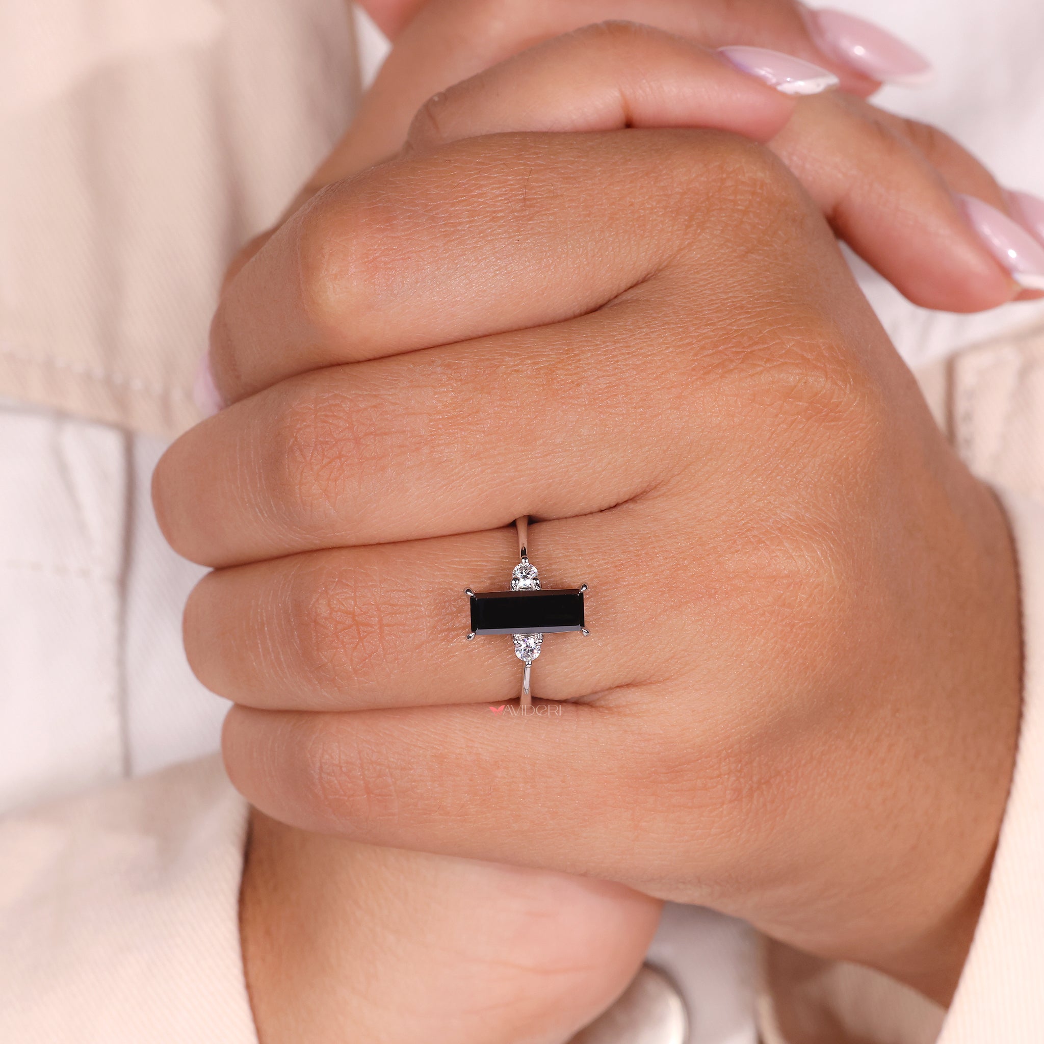 3 stone engagement ring crafted in a moissanite bypass design
