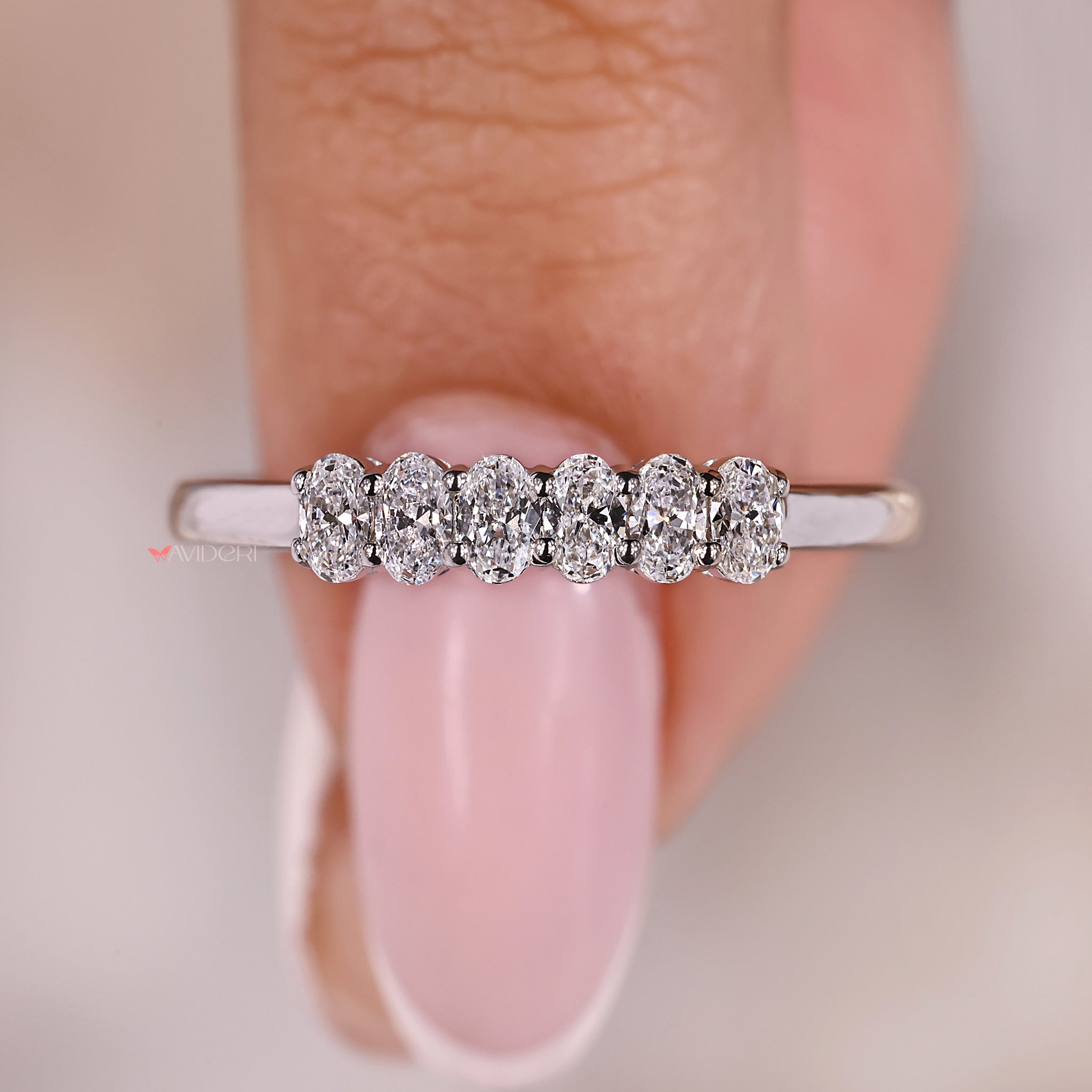 A shared prong ring with elegant lab-created diamonds.