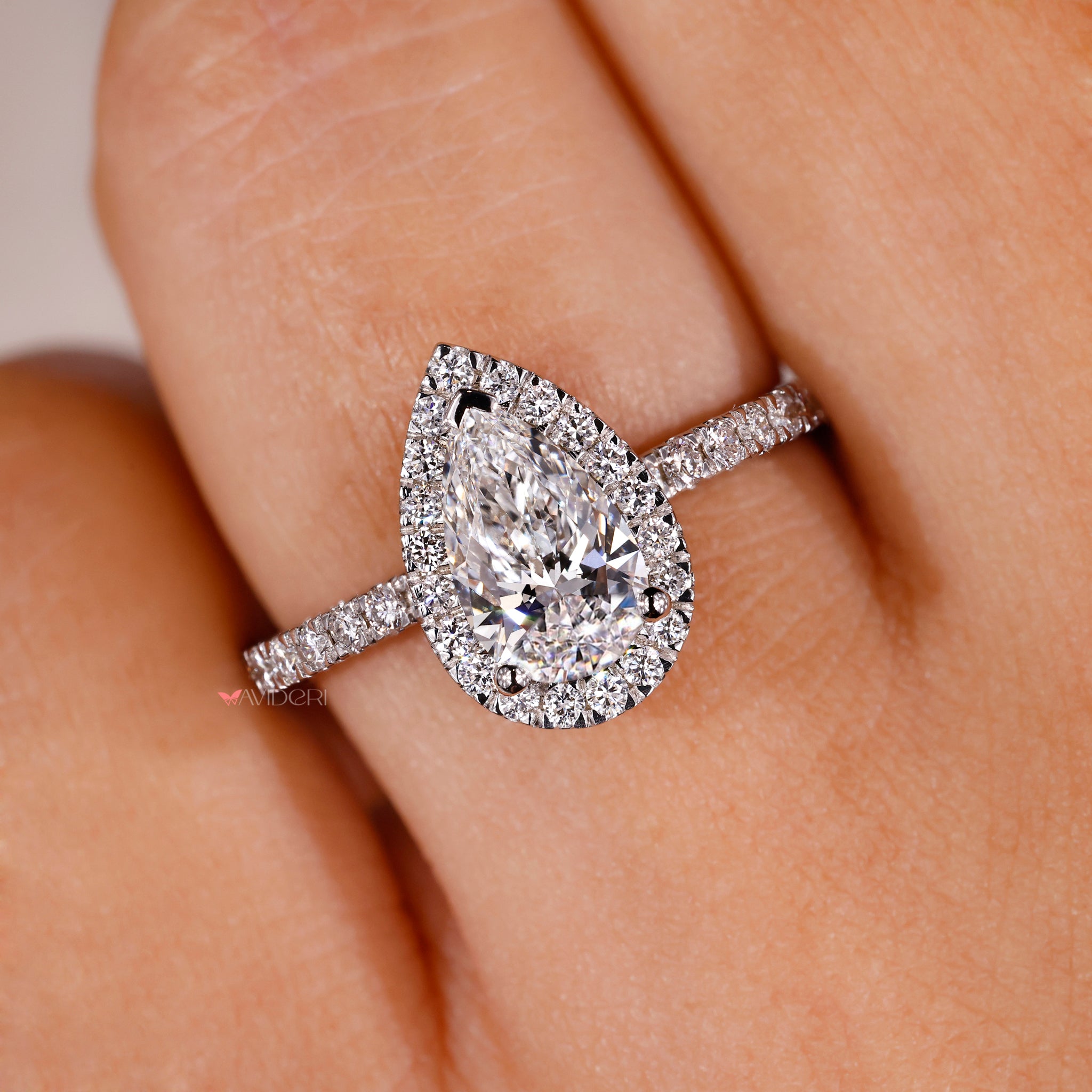 Handmade jewelry ring with round cut halo diamond.