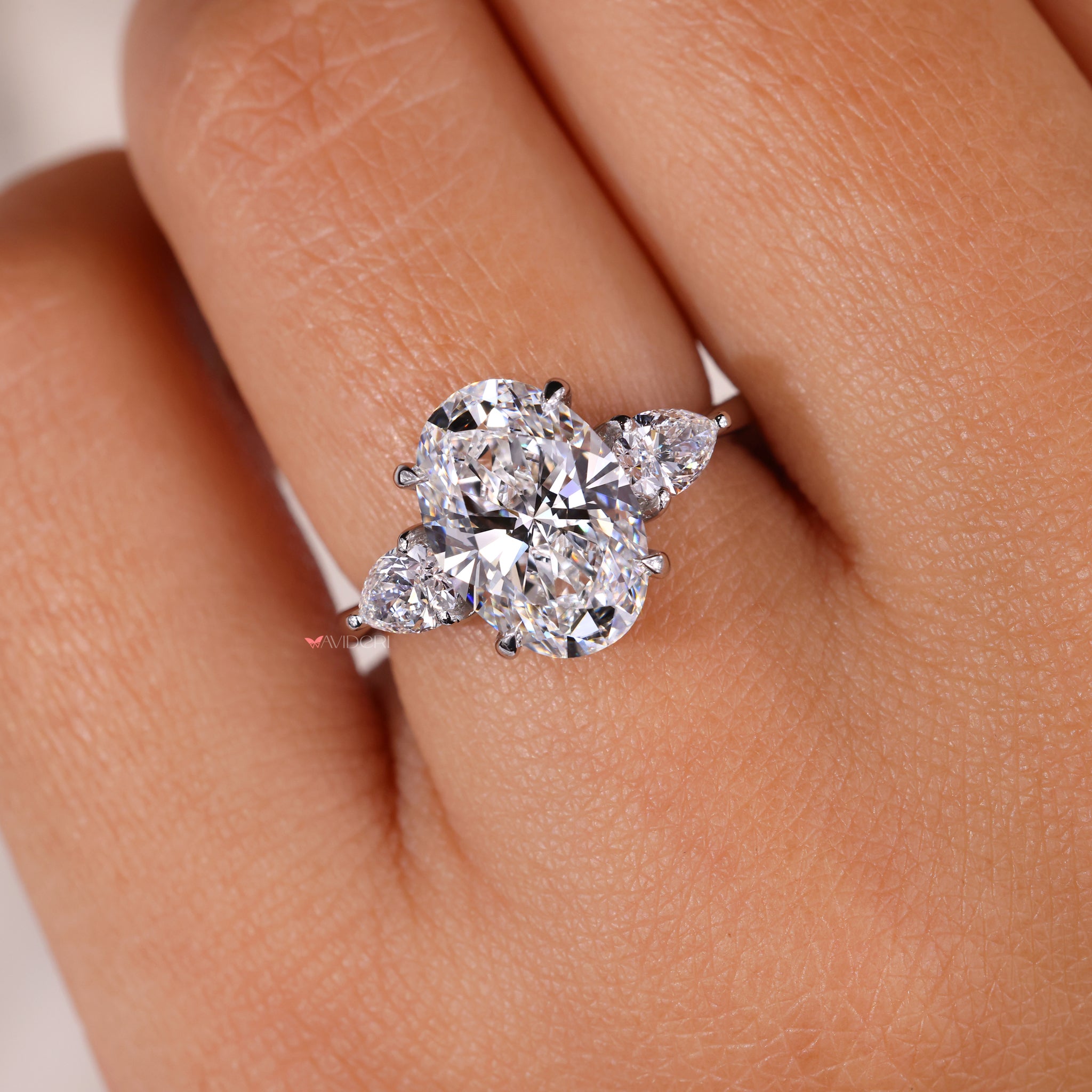 Avideri ring with a three stone oval diamond for an elegant statement.