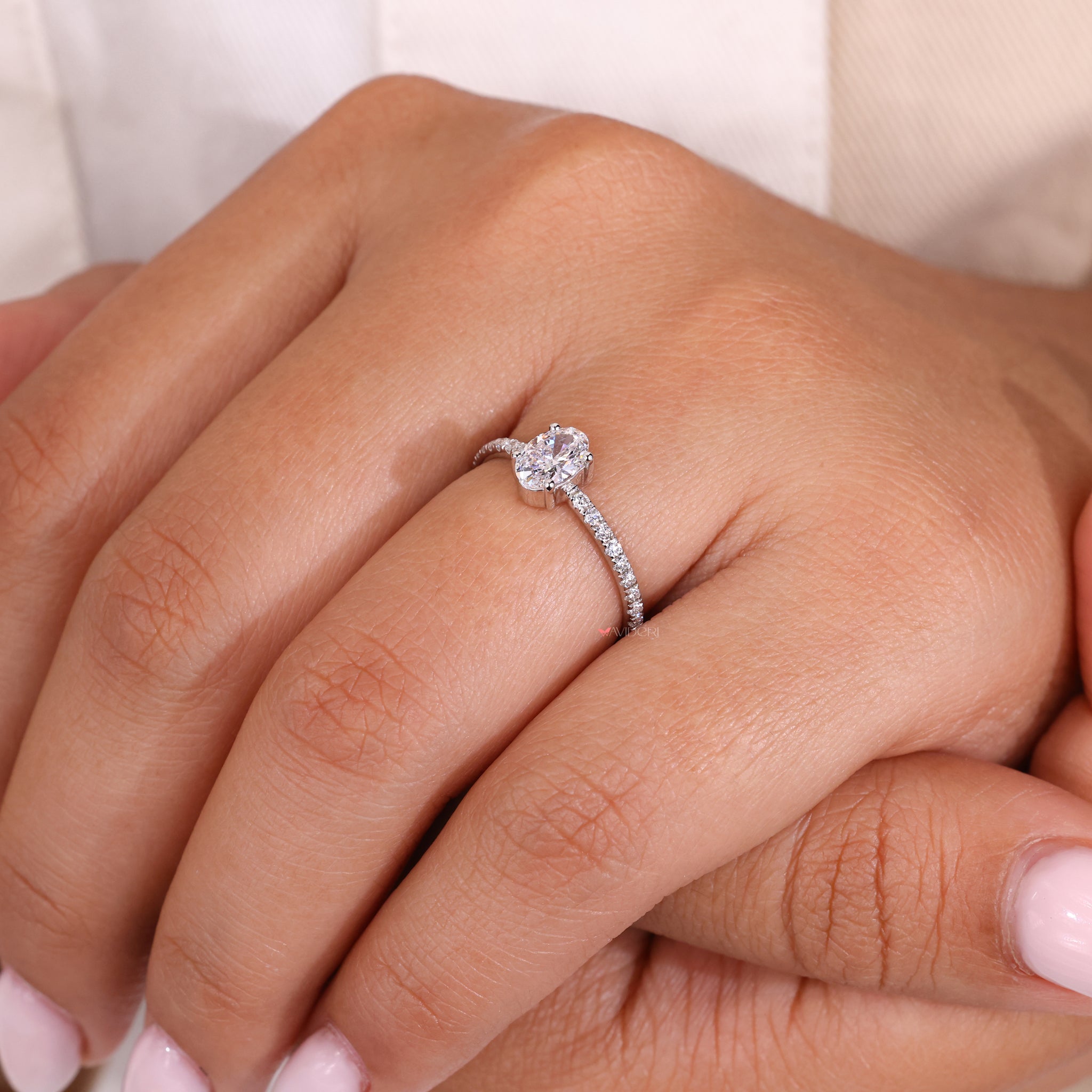 IGI certified oval shaped engagement ring with a flawless design.