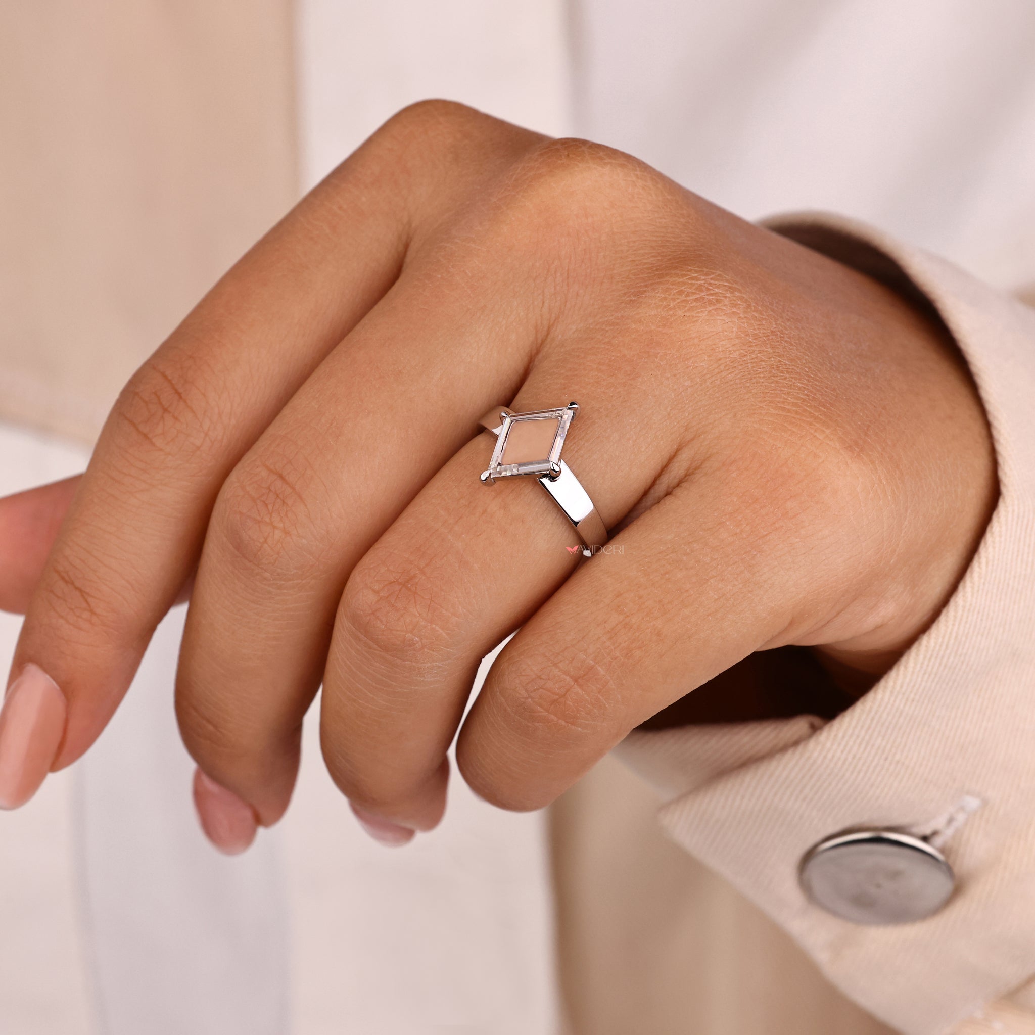 Lab Grown Diamond engagement ring with a solitaire diamond in a compass prong setting.