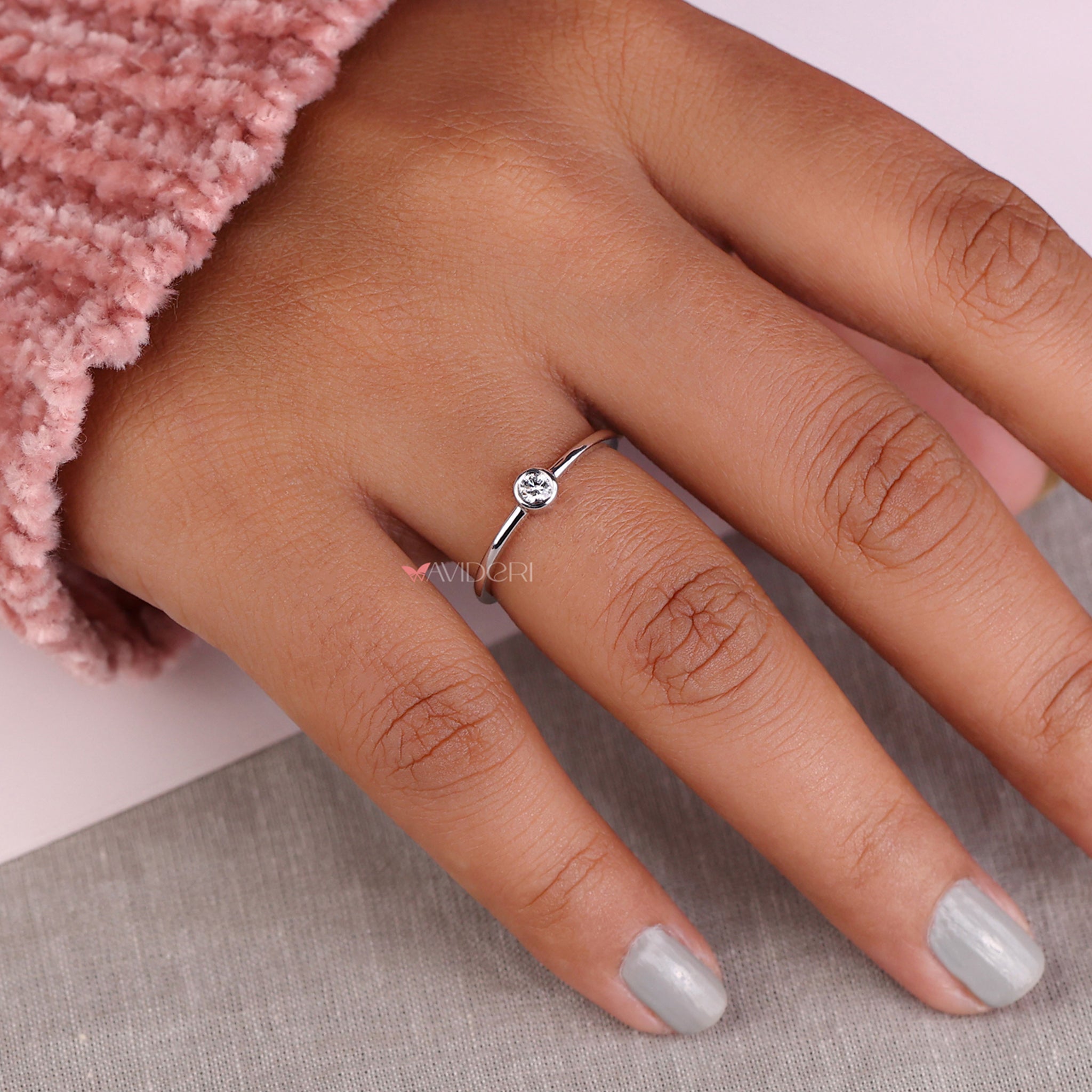 Solitaire bezel ring showcasing an IGI certified diamond with unmatched sparkle and brilliance.