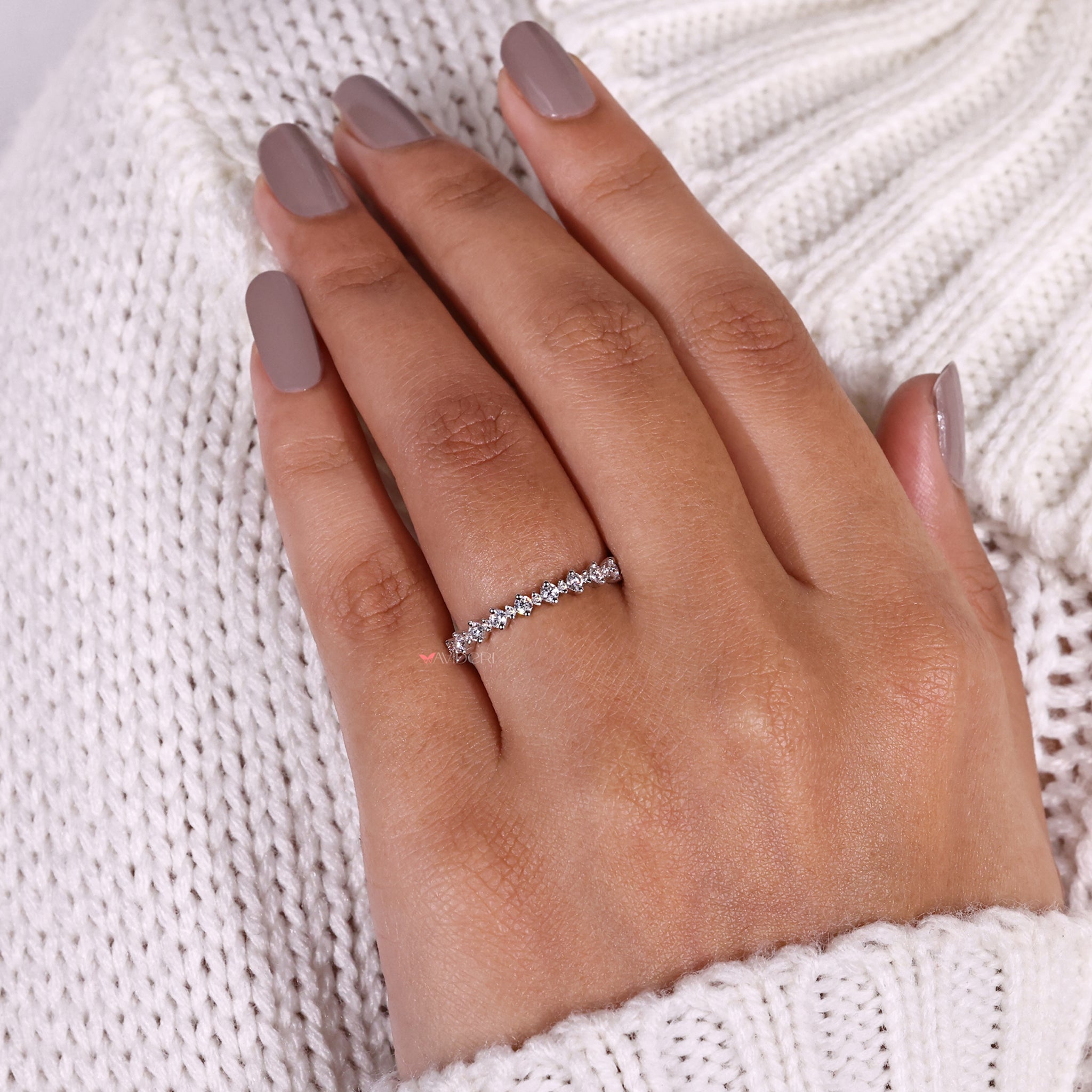 Sophisticated round half eternity band with diamonds for continuous sparkle.
