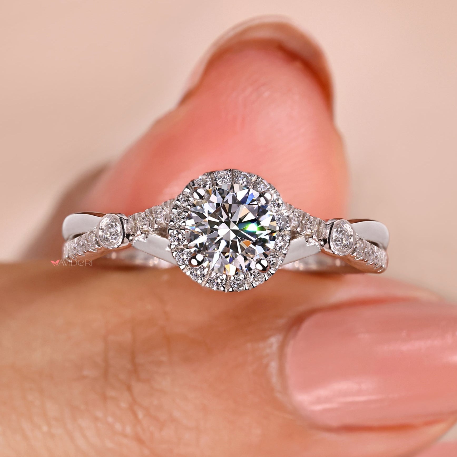 Halo diamond ring with a lab-grown diamond.