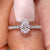 Pear diamond engagement ring with round side stones. Pear diamond engagement ring with round side stones.