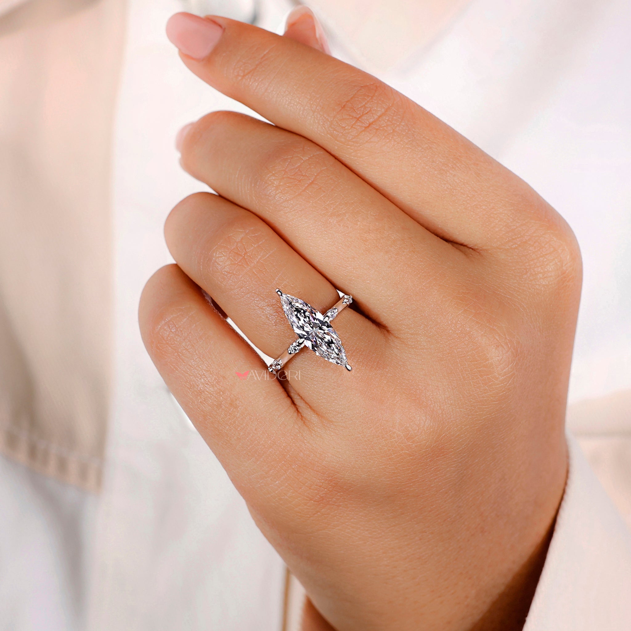 4 prong diamond ring with a white gold and diamond ring.