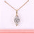 Diamond necklace with rose gold chain on a pink background Diamond necklace with rose gold chain on a pink background