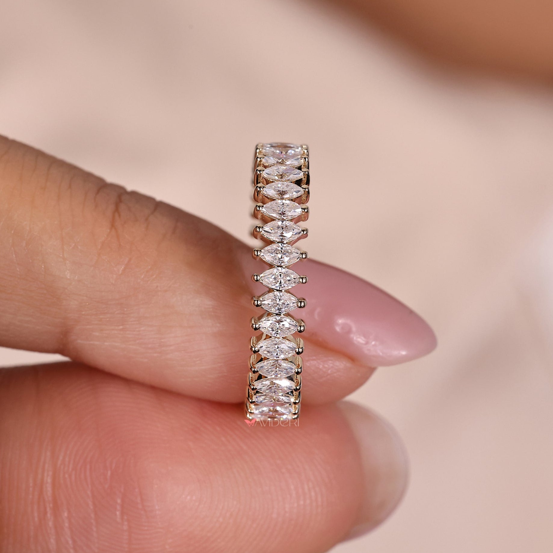 Marquise wedding band in gold with a sleek design.