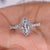 Marquise halo engagement ring featuring a sparkling diamond set in a classic halo design with exquisite craftsmanship.
 Marquise halo engagement ring featuring a sparkling diamond set in a classic halo design with exquisite craftsmanship.