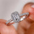 Emerald diamond ring with a halo setting.
 Emerald diamond ring with a halo setting.