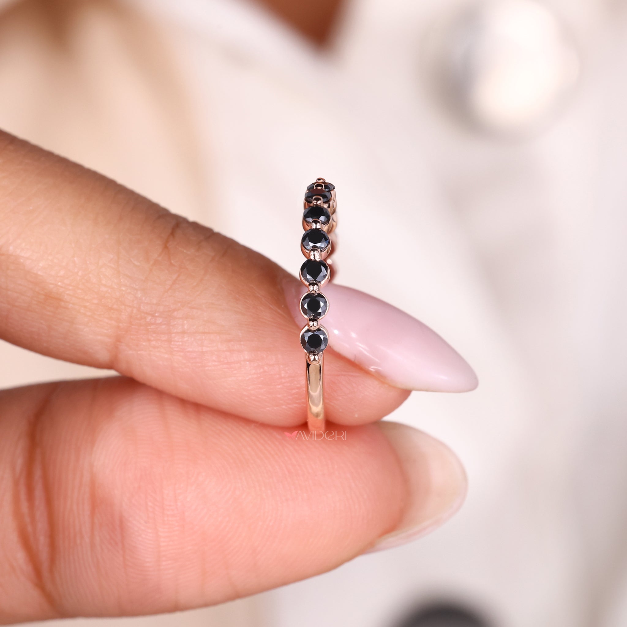 Moissanite eternity band in a shared prong band setting for sparkle.