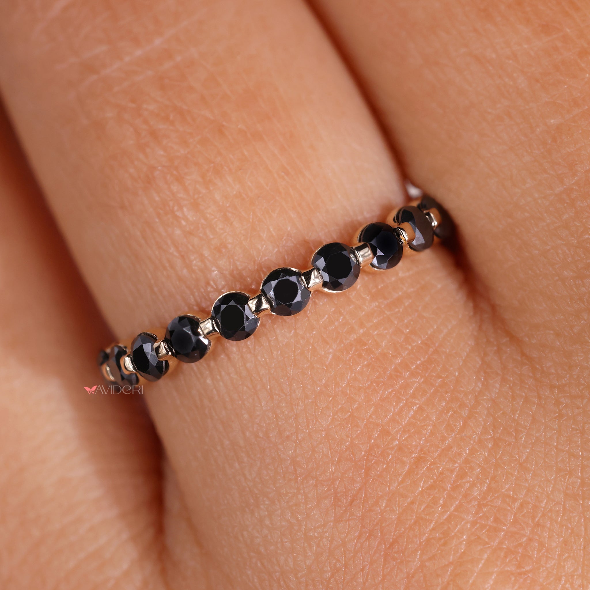 The white gold wedding band complements any gemstone with elegance.