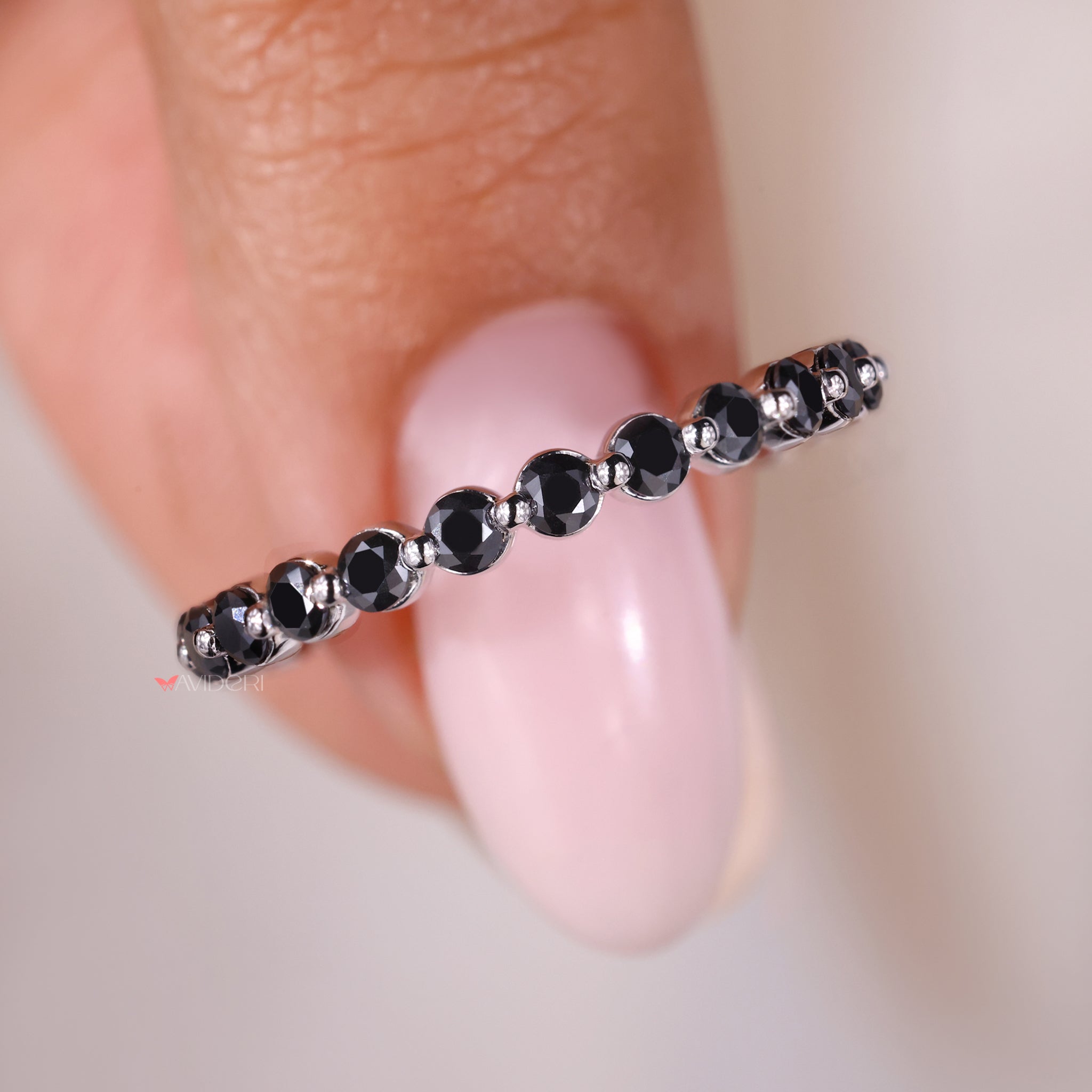 Moissanite eternity band set in a white gold wedding band for elegance.