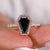 Black moissanite engagement ring with a sleek and modern design.
 Black moissanite engagement ring with a sleek and modern design.