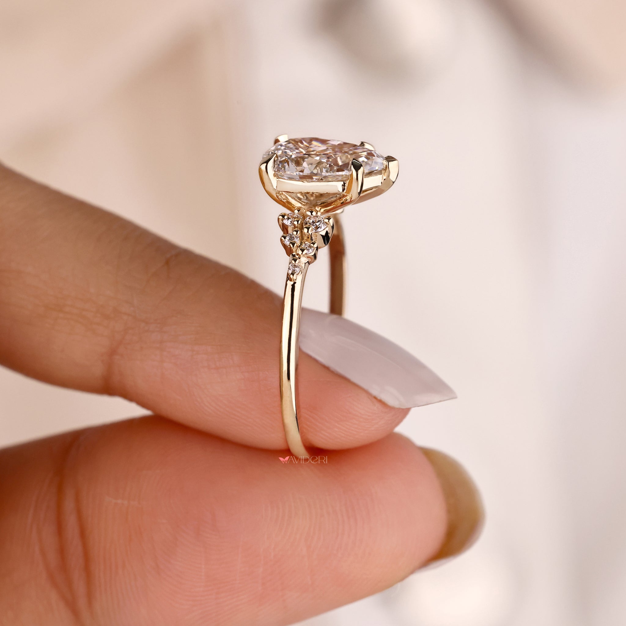 Pear diamond ring with a round diamond engagement ring.
