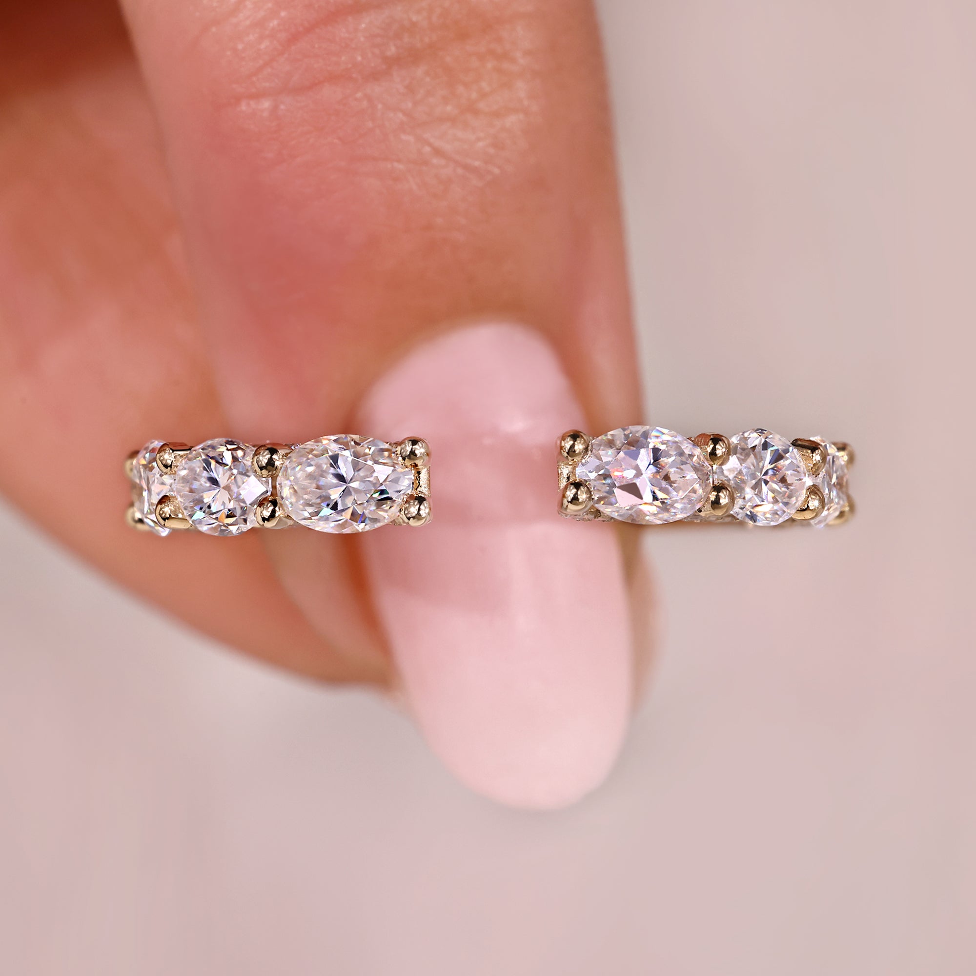 Oval cut wedding band with tapered shank band.