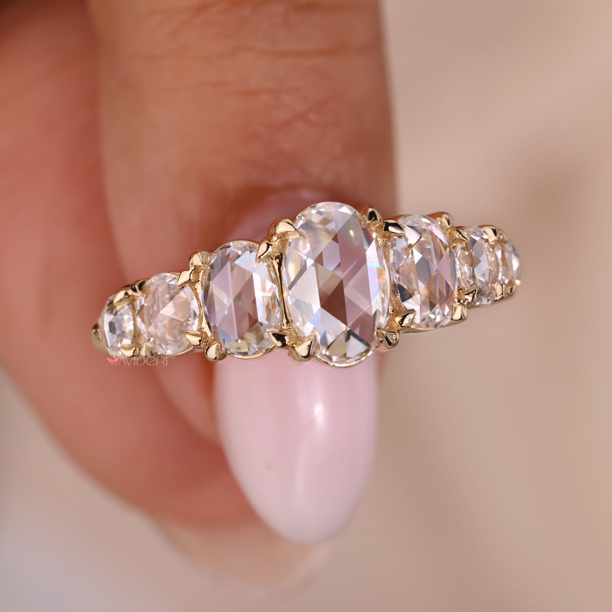 Oval diamond band set in a beautiful gold band oval diamond ring design.