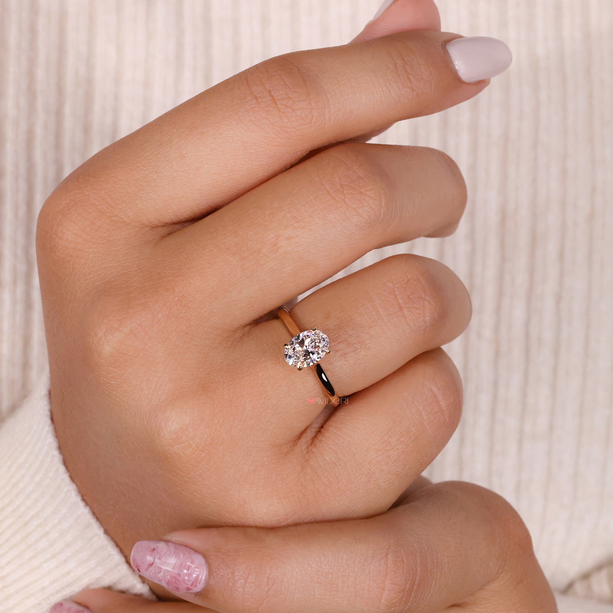 Oval cut diamond with unmatched brilliance, set in a handmade solitaire ring crafted for elegance.