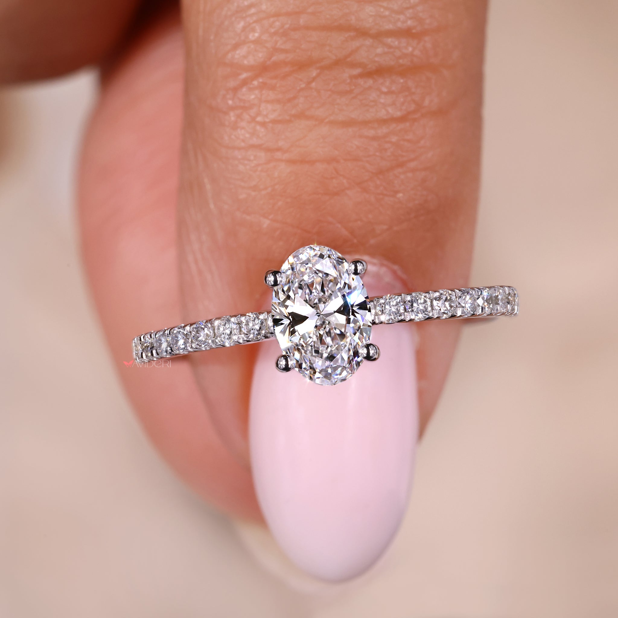 Oval shaped engagement ring set in a pave setting ring for extra sparkle.