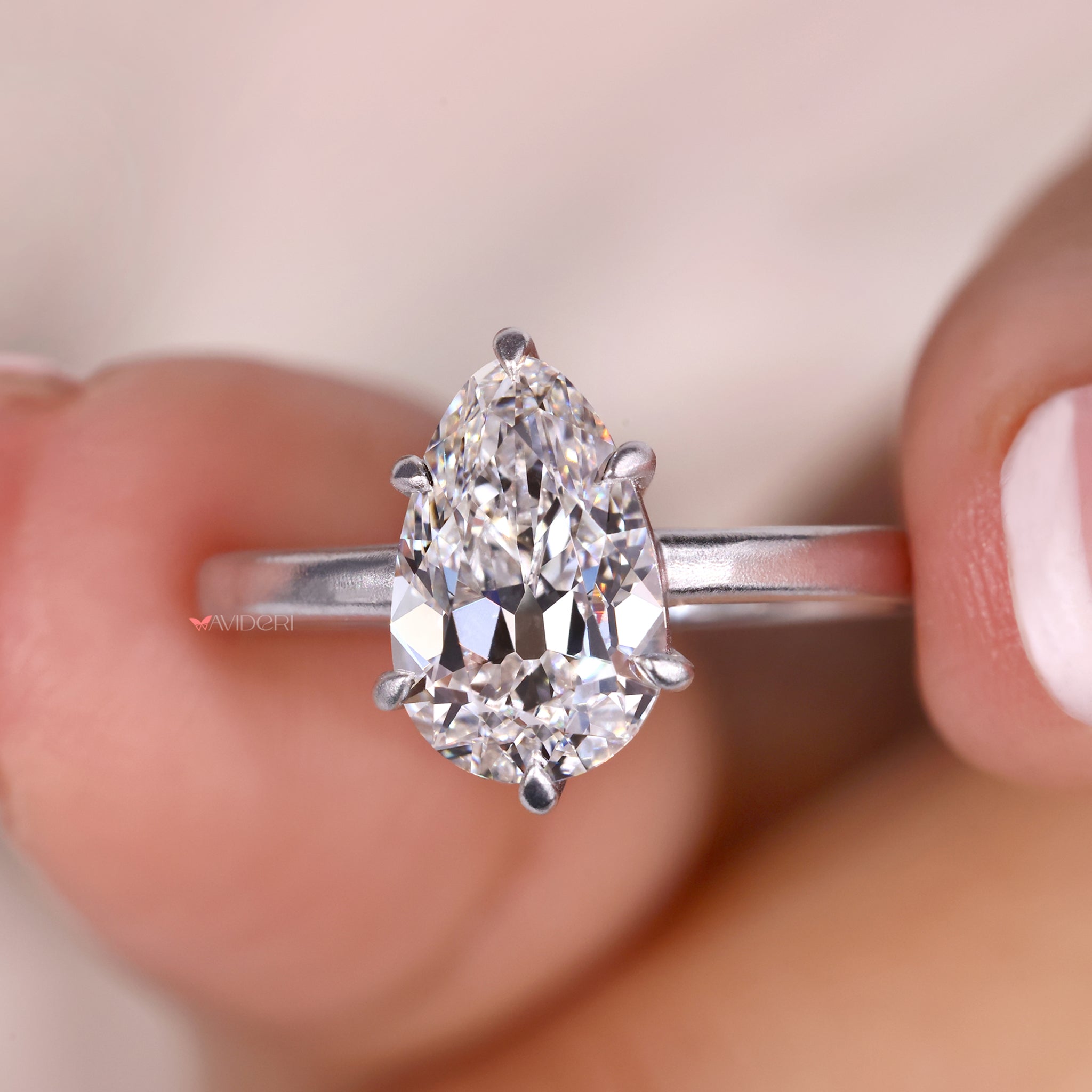 Solitaire engagement ring with a dazzling pear shaped diamond.