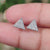Handmade jewelry featuring triangle stud earrings set in white gold.