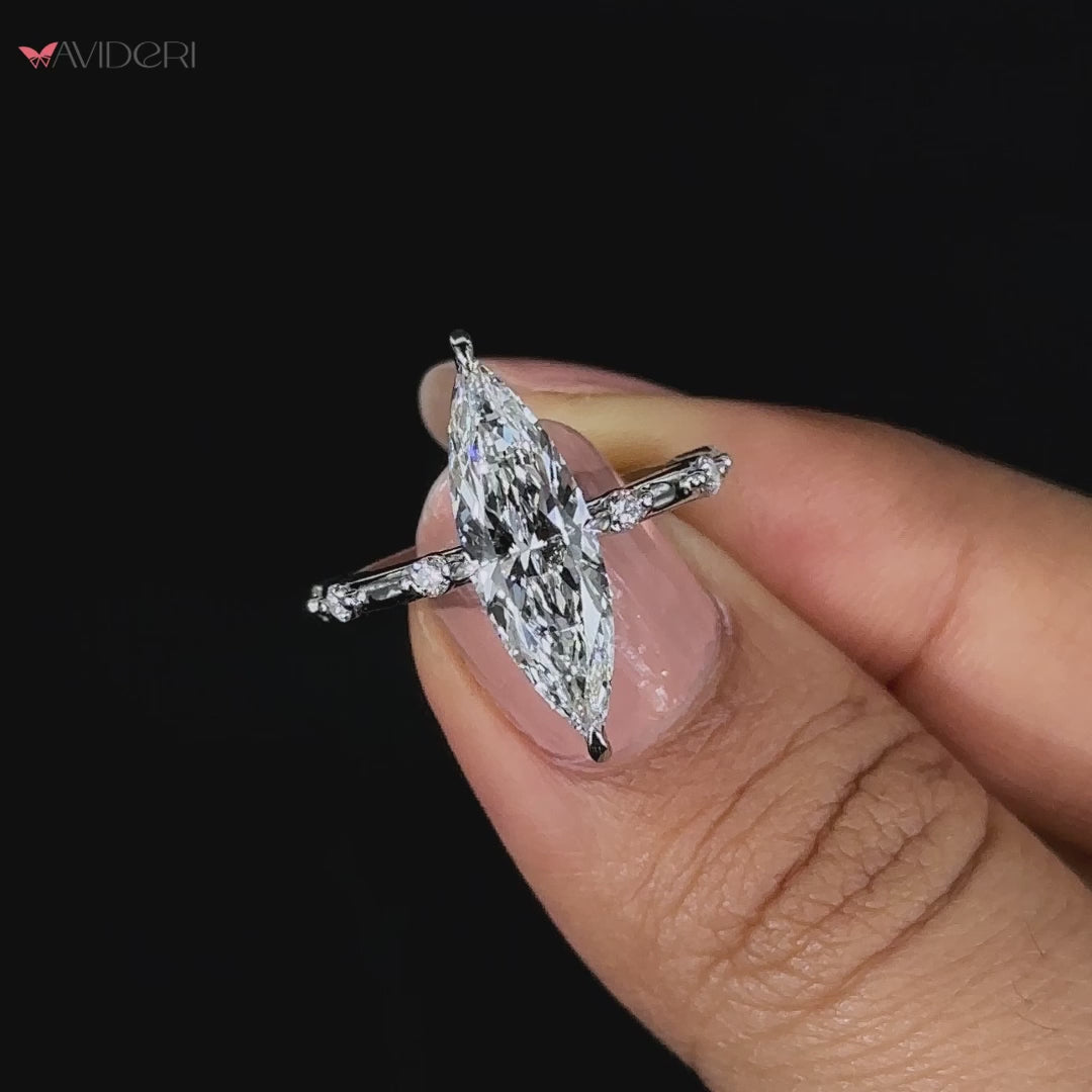 Marquise engagement ring with a 4 prong diamond ring.