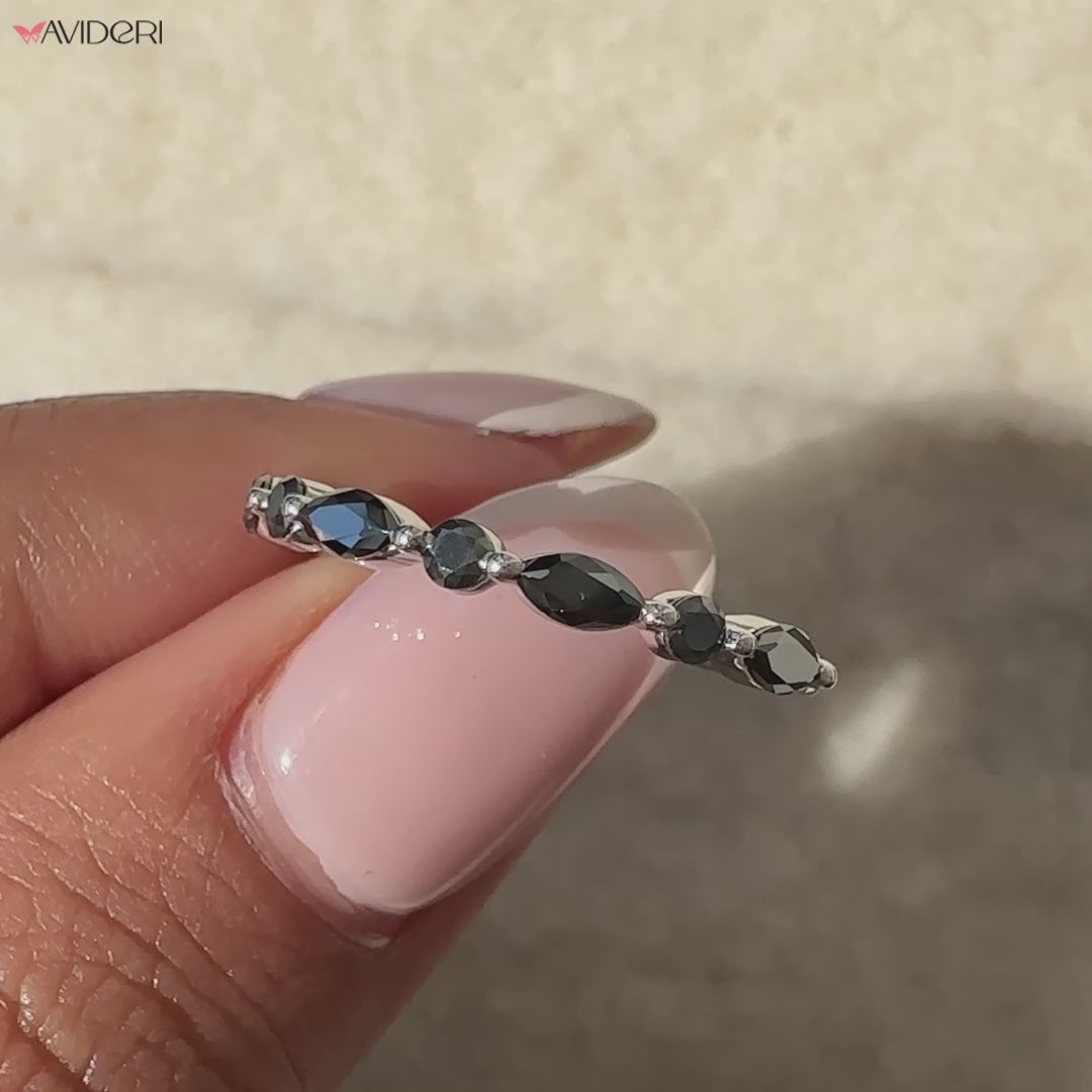 Avideri band with a stunning marquise and round setting.