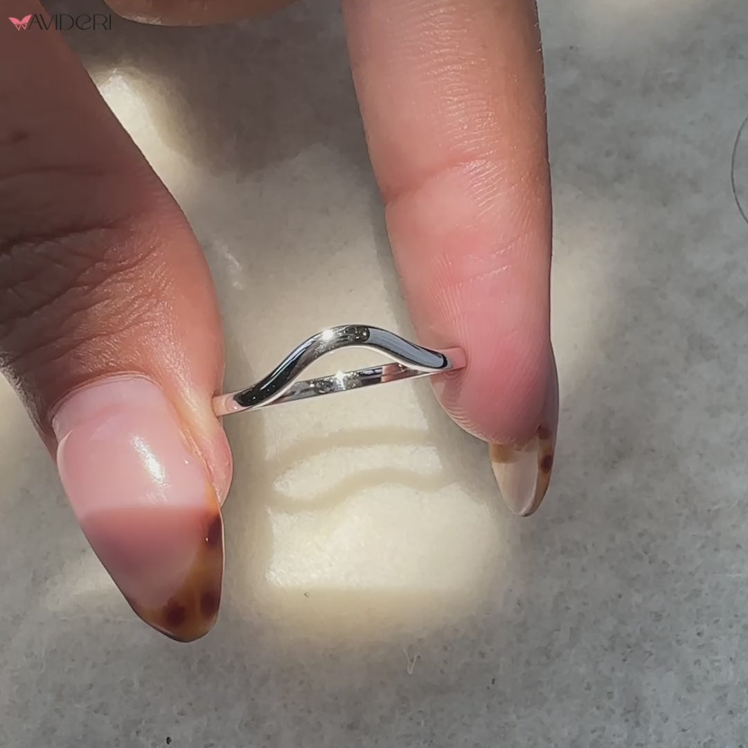 U shaped wedding band crafted in white gold for a sleek look.