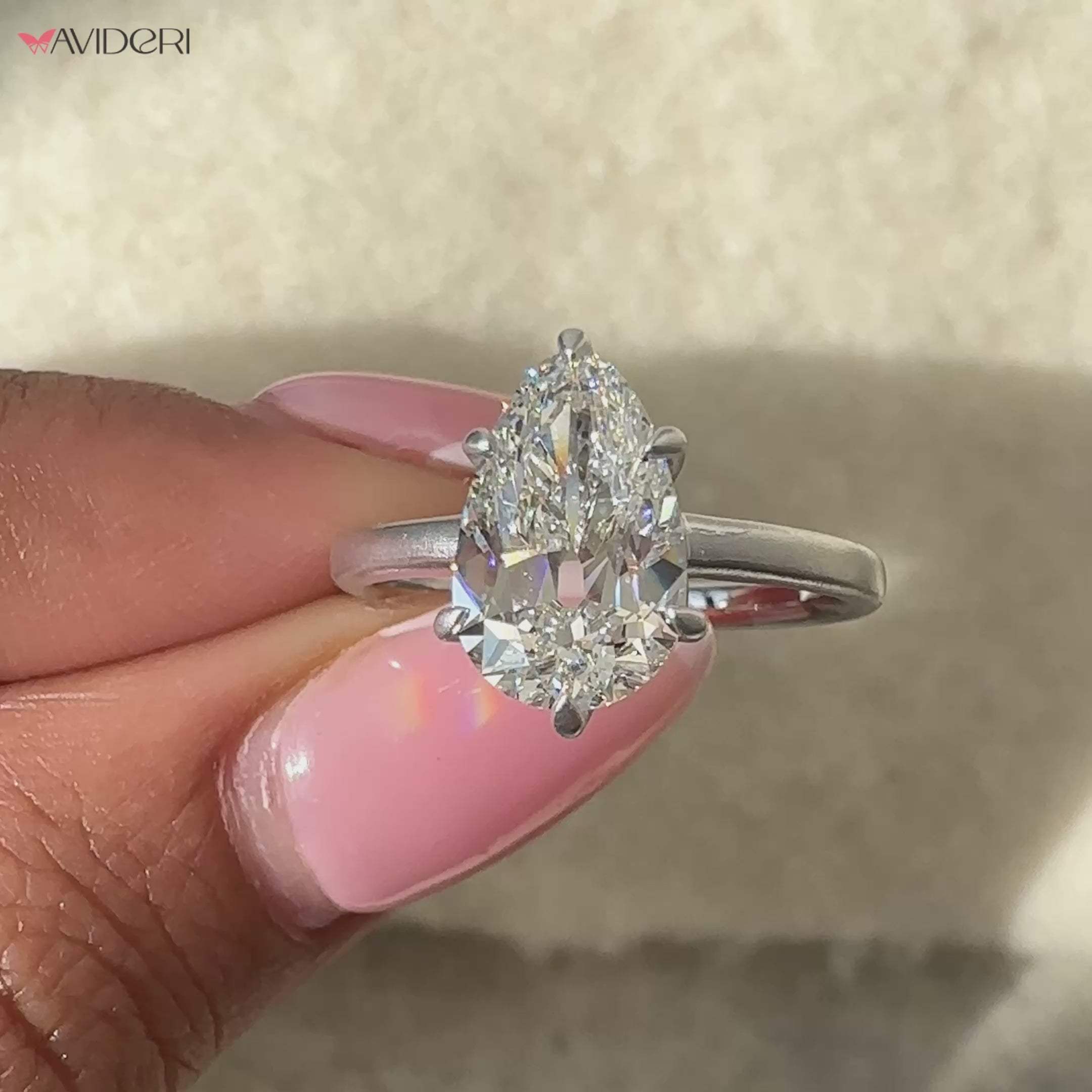 Elegant pear diamond engagement ring set in a beautiful white gold band.