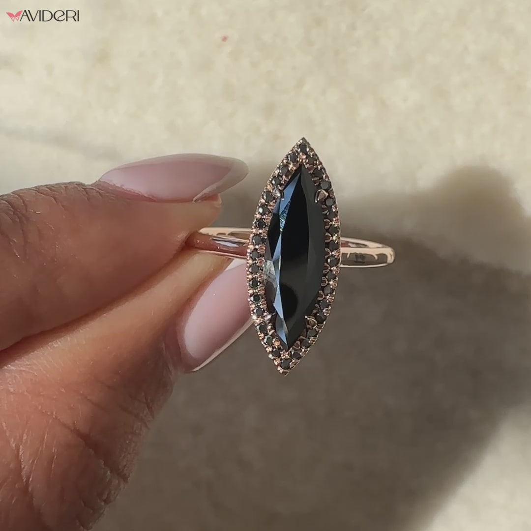 Elongated halo engagement ring glowing with brilliance.
