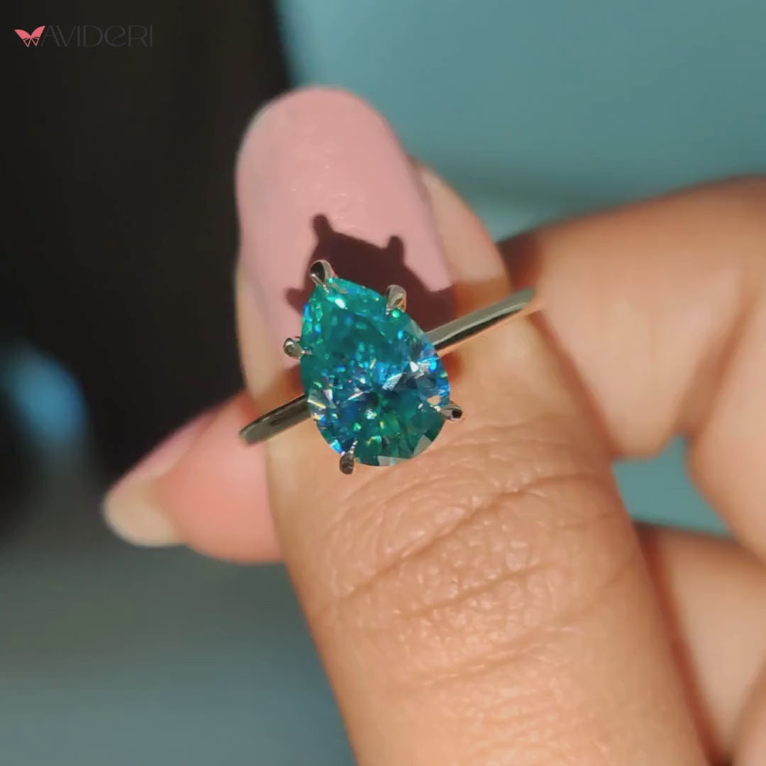 This cyan blue moissanite ring offers a bold yet elegant look.