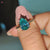 This cyan blue moissanite ring offers a bold yet elegant look.