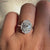 Avideri Ring with a classic halo design and white gold prong setting.