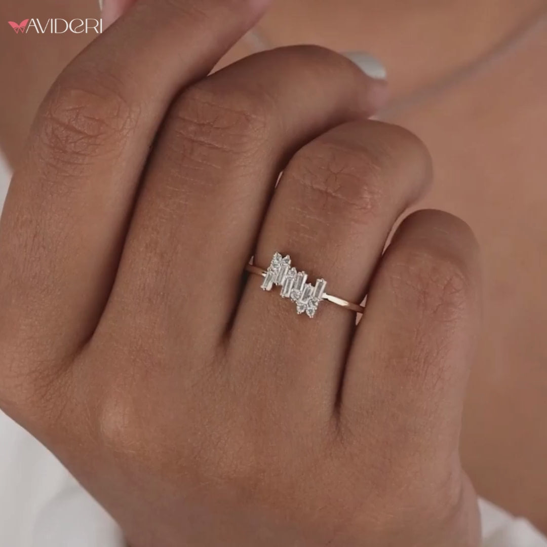 A gold zig zag ring with a modern, wavy design.