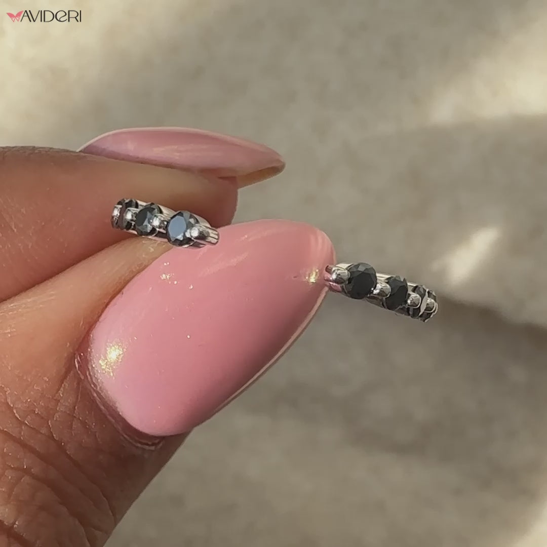 White gold moissanite wedding band with a round cut wedding band design.