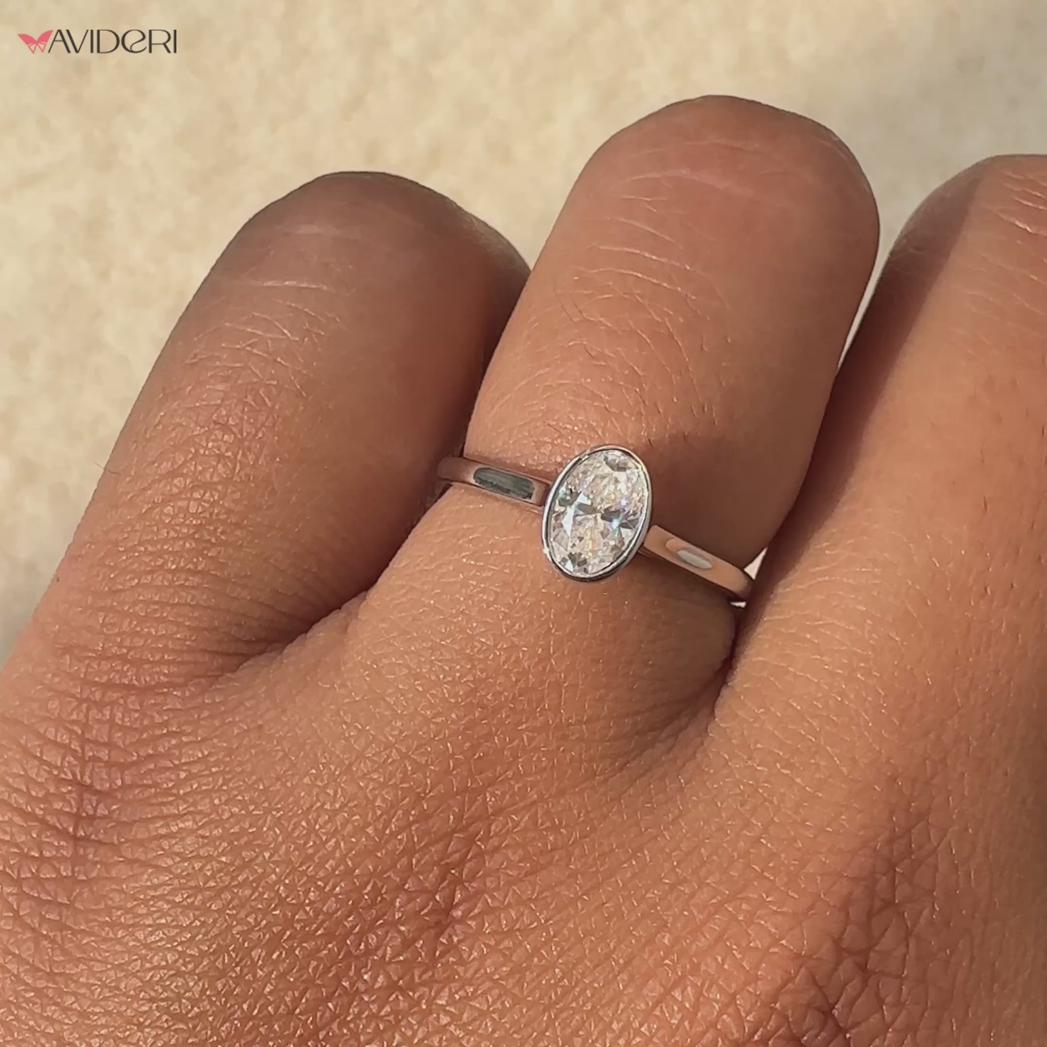 The oval solitaire moissanite ring offers graceful sparkle and elegance.